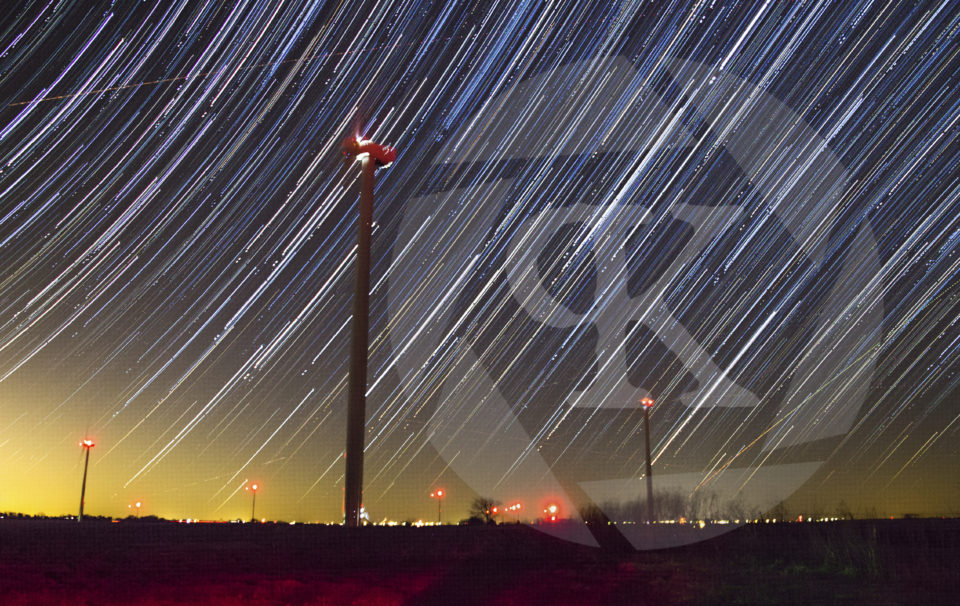 A windfarm surrounded by star trails
