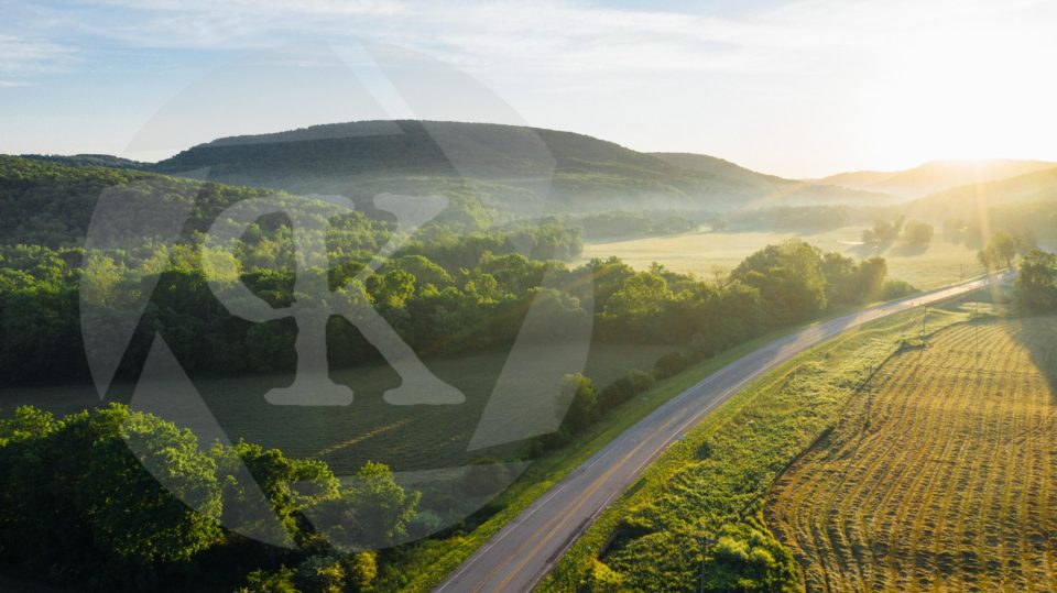 Aerial shot of a road at sunset