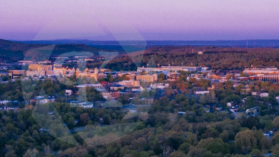 Aerial shot of a town at sunset